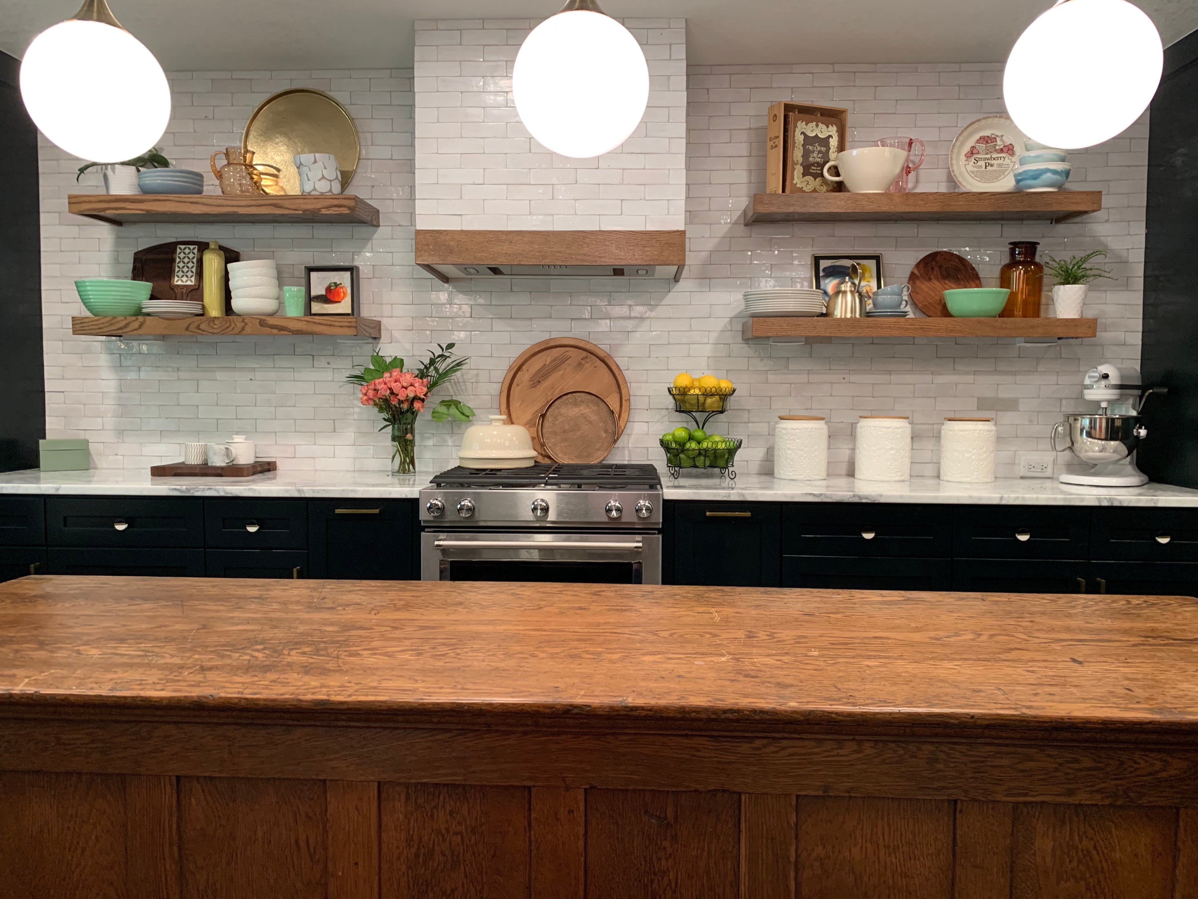 Modern interior design kitchen with black marble, black cabinets, dark gold  trim and granite countertop, 3d render, 3d illustration Stock Illustration